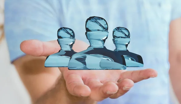 Бізнесмен тримає блискучу скляну аватарів групу 3D рендерингу — стокове фото