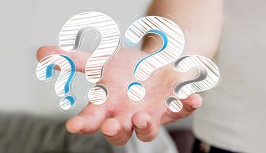 Elle çizilmiş soru işaretleri elinde tutan işadamı