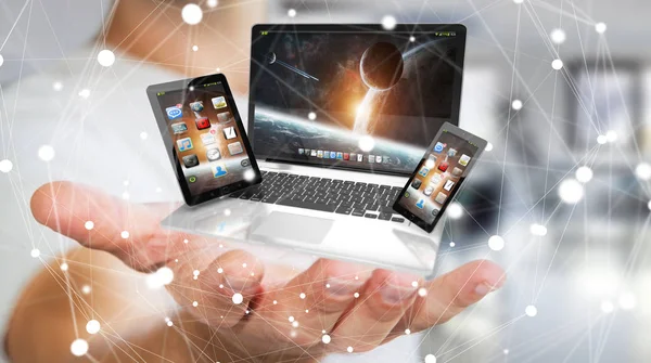 Pengusaha memegang telepon laptop dan tablet di tangannya 3D rende — Stok Foto