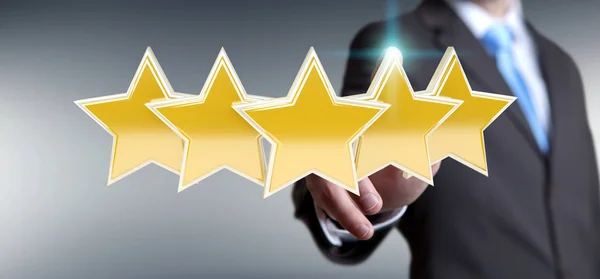 Businessman rating stars with his hand 3D rendering