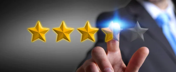 Businessman rating stars with his hand