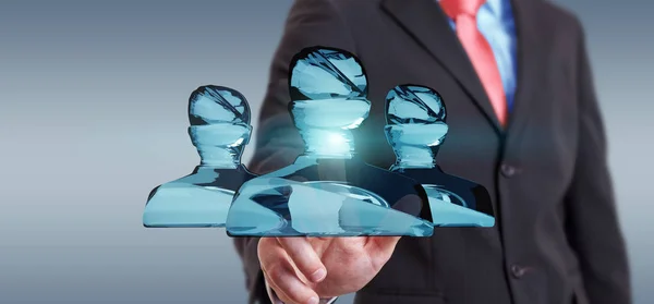 Businessman touching shiny glass avatar group 3D rendering