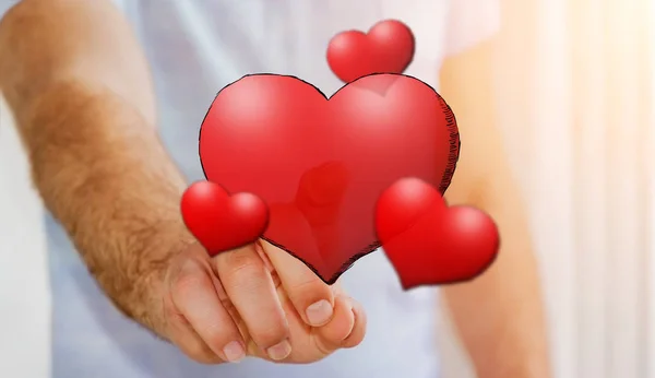 Jovem tocando mão desenhado coração vermelho — Fotografia de Stock