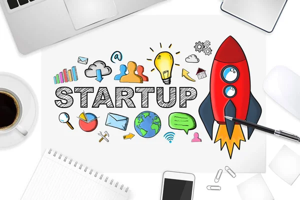 Hand drawn startup text with icons on office background — Stock Photo, Image