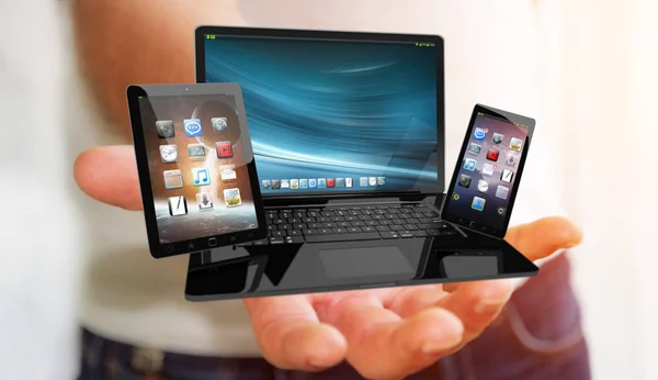 Бизнесмен держит ноутбук и планшет в руке 3D ренде — стоковое фото