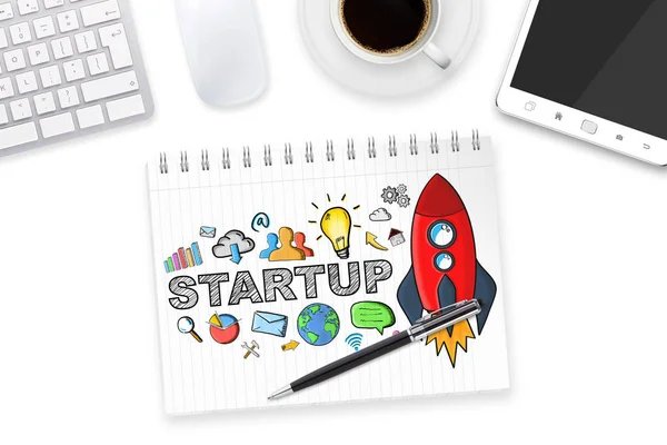 Hand drawn startup text with icons on office background — Stock Photo, Image