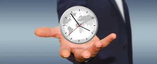 Businessman holding a clock in his hand — Stock Photo, Image