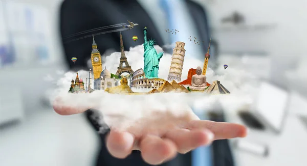 Businessman holding a cloud full of famous monuments in his hand — Stock Photo, Image