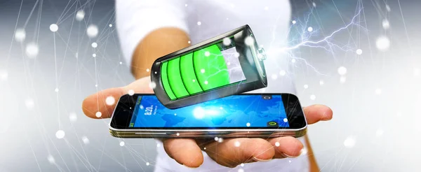 Человек, держащий 3D-батарею с молнией над телефоном — стоковое фото