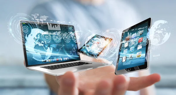 Businessman connecting tech devices to each other 3D rendering — Stock Photo, Image