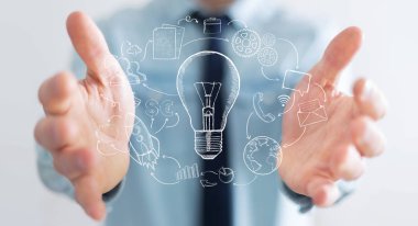 Elle çizilmiş ampul ve Multimedya simgeler tutan işadamı