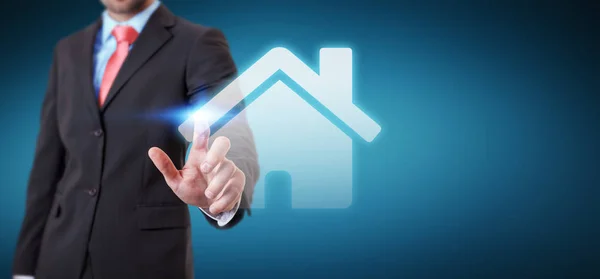 Businessman touching 3D rendering icon house with his finger — Stock Photo, Image