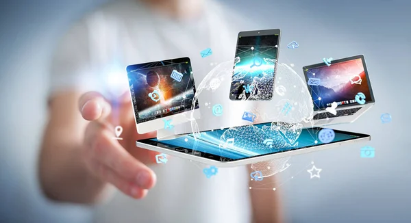 Businessman connecting tech devices to each other 3D rendering — Stock Photo, Image