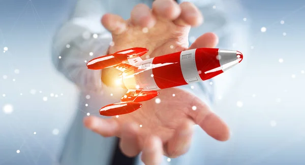 Empresário segurando foguete vermelho em sua mão 3D renderização — Fotografia de Stock
