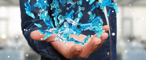 Geschäftsmann hält 3D-Rendering-Gruppe von blauen Menschen — Stockfoto