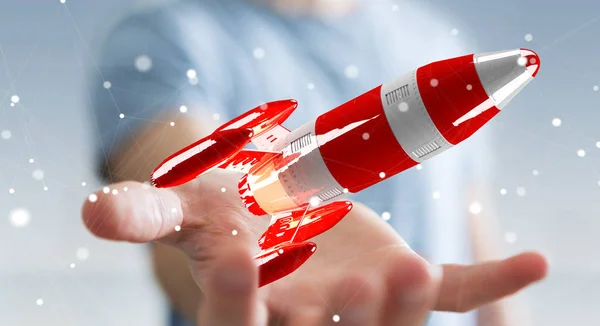 Geschäftsmann mit roter Rakete in der Hand — Stockfoto