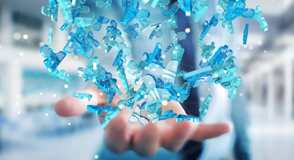 Affärsman som håller 3d rendering grupp blå människor — Stockfoto