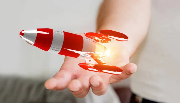 Επιχειρηματίας που κατέχουν κόκκινο πυραύλων σε 3d rendering του χέρι — Φωτογραφία Αρχείου