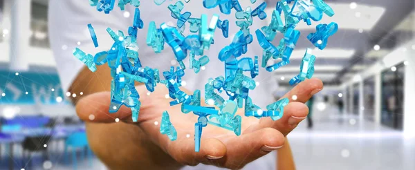 Бизнесмен, держащий группу синих людей в 3D рендеринге — стоковое фото