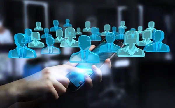 Affärsman som håller 3d rendering grupp blå människor — Stockfoto