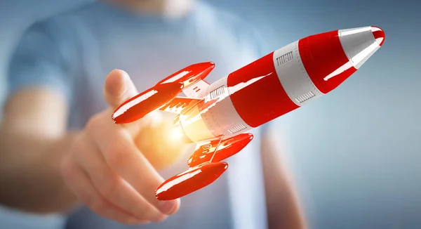 Бизнесмен держит красную ракету в руке 3D рендеринг — стоковое фото