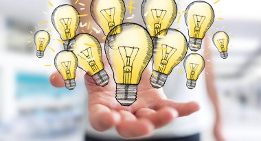 Çizilmiş ampul elinde tutan işadamı