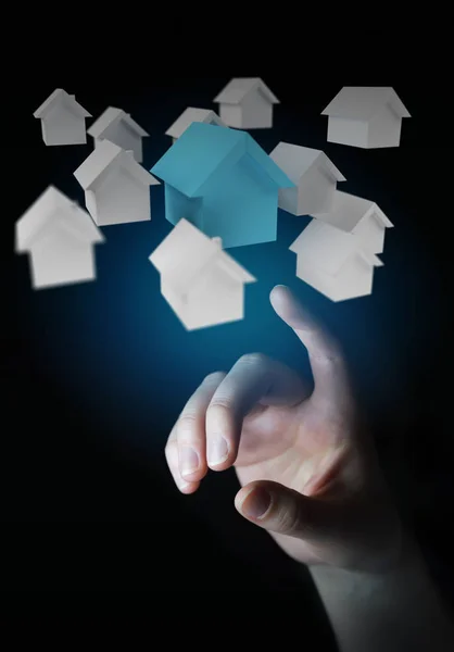 Geschäftsmann mit 3D gerenderten kleinen weißen und blauen Häusern — Stockfoto