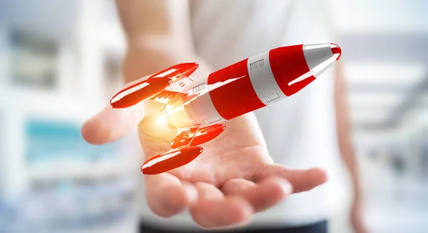 Kırmızı roket onun el 3d render tutan işadamı — Stok fotoğraf