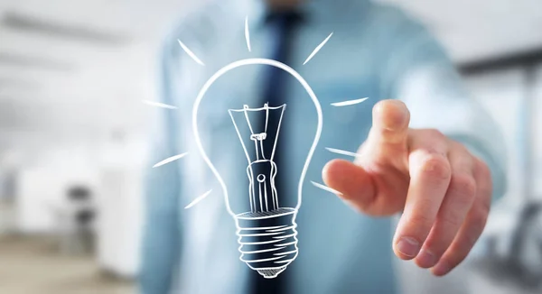 Businessman touching a sketch lightbulb — Stock Photo, Image