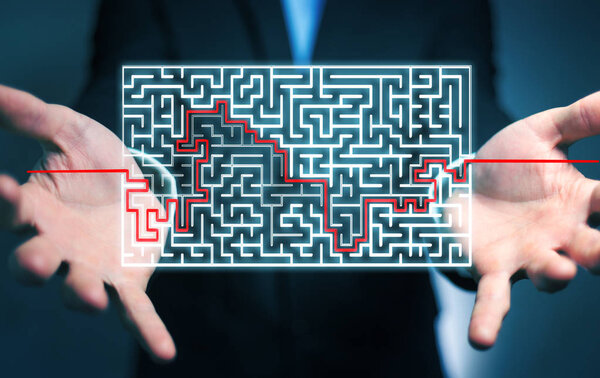 Businessman searching solution of a complicated maze