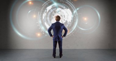 Bir duvar 3d re dijital planet earth arabirimini kullanarak iş adamı