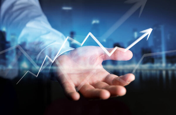 Businessman holding hand-drawn arrow going up