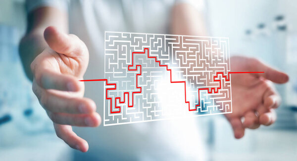 Businessman searching solution of a complicated maze