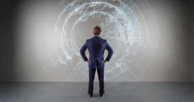 Bir duvar 3d re dijital planet earth arabirimini kullanarak iş adamı