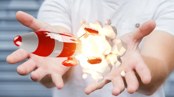 Üzletember gazdaság piros rakéta az ő kezét 3d-leképezés — Stock Fotó