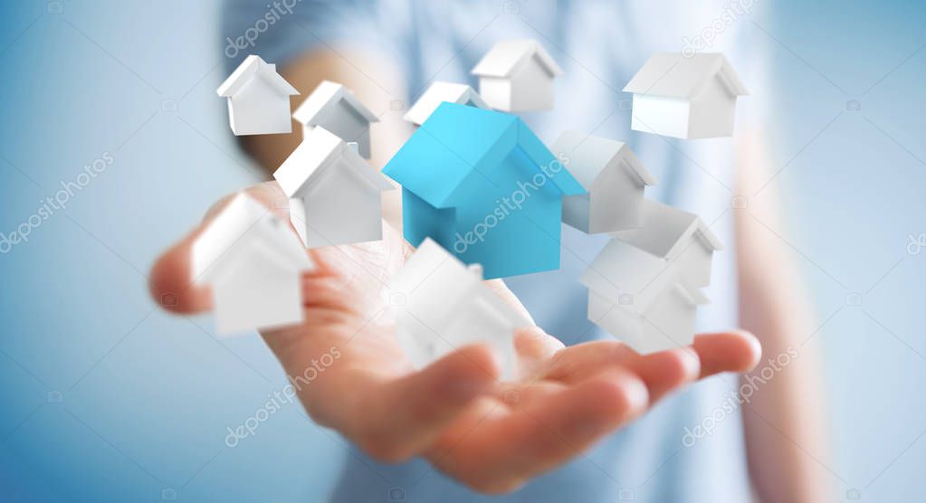 Businessman using 3D rendered small white and blue houses