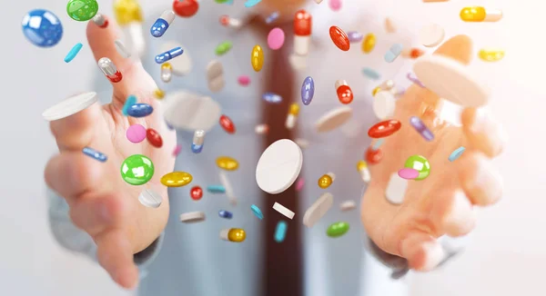 Empresário segurando e tocando pílulas de medicina flutuante 3D rend — Fotografia de Stock