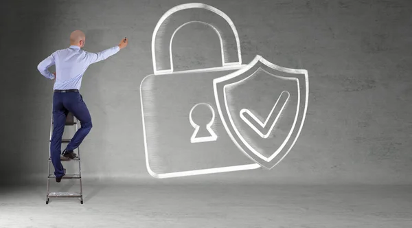 Businessman drawing internet security interface sketch on a wall — Stock Photo, Image