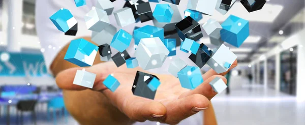 Empresario sosteniendo flotante azul brillante cubo red 3D renderin — Foto de Stock