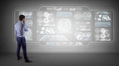 Bir duvara 3d render grafik ekranlar arabirimini kullanarak iş adamı