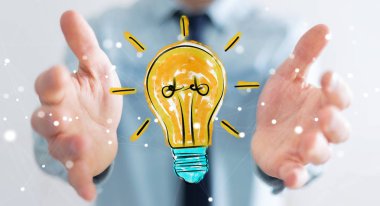 Holding ve bir ampul dokunmadan işadamı kroki