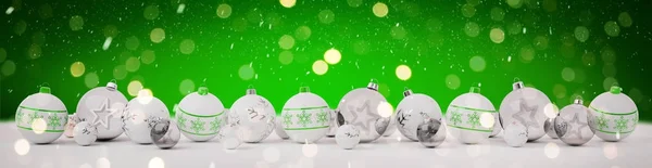 White and green christmas baubles lined up 3D rendering