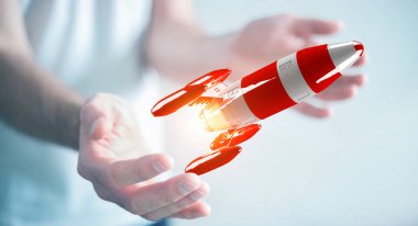 Kırmızı roket onun el 3d render tutan işadamı