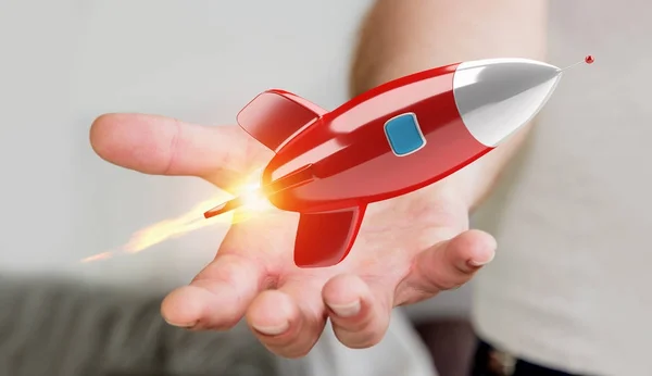 Бизнесмен держит и трогает ракету 3D рендеринга — стоковое фото