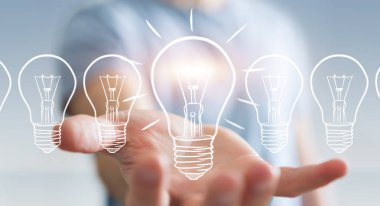 Bir kroki ampul tutan işadamı