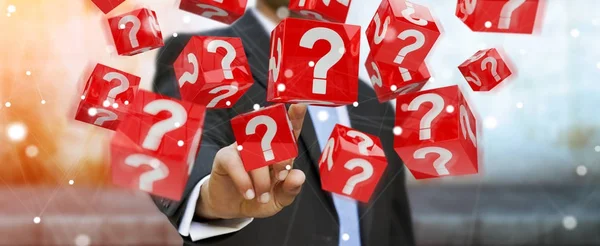 Businessman using cubes with 3D rendering question marks — Stock Photo, Image