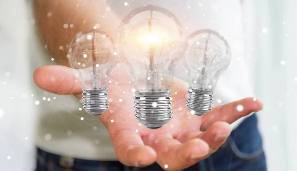 Businessman connecting modern lightbulbs with connections 3D ren — Stock Photo, Image