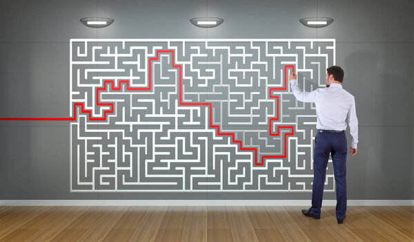Businessman searching maze solution on a wall 3D rendering