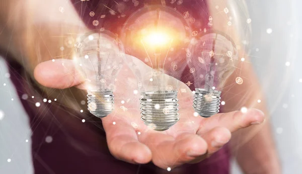 Empresario conectar bombillas modernas con conexiones 3D ren — Foto de Stock
