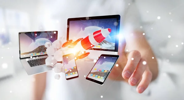 Businessman connecting tech devices and startup rocket 3D render — Stock Photo, Image